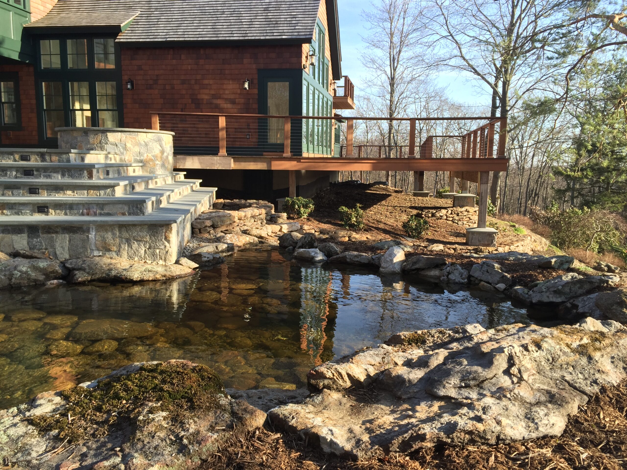 IMG_3138 Stone patio integrated with a backyard pond
