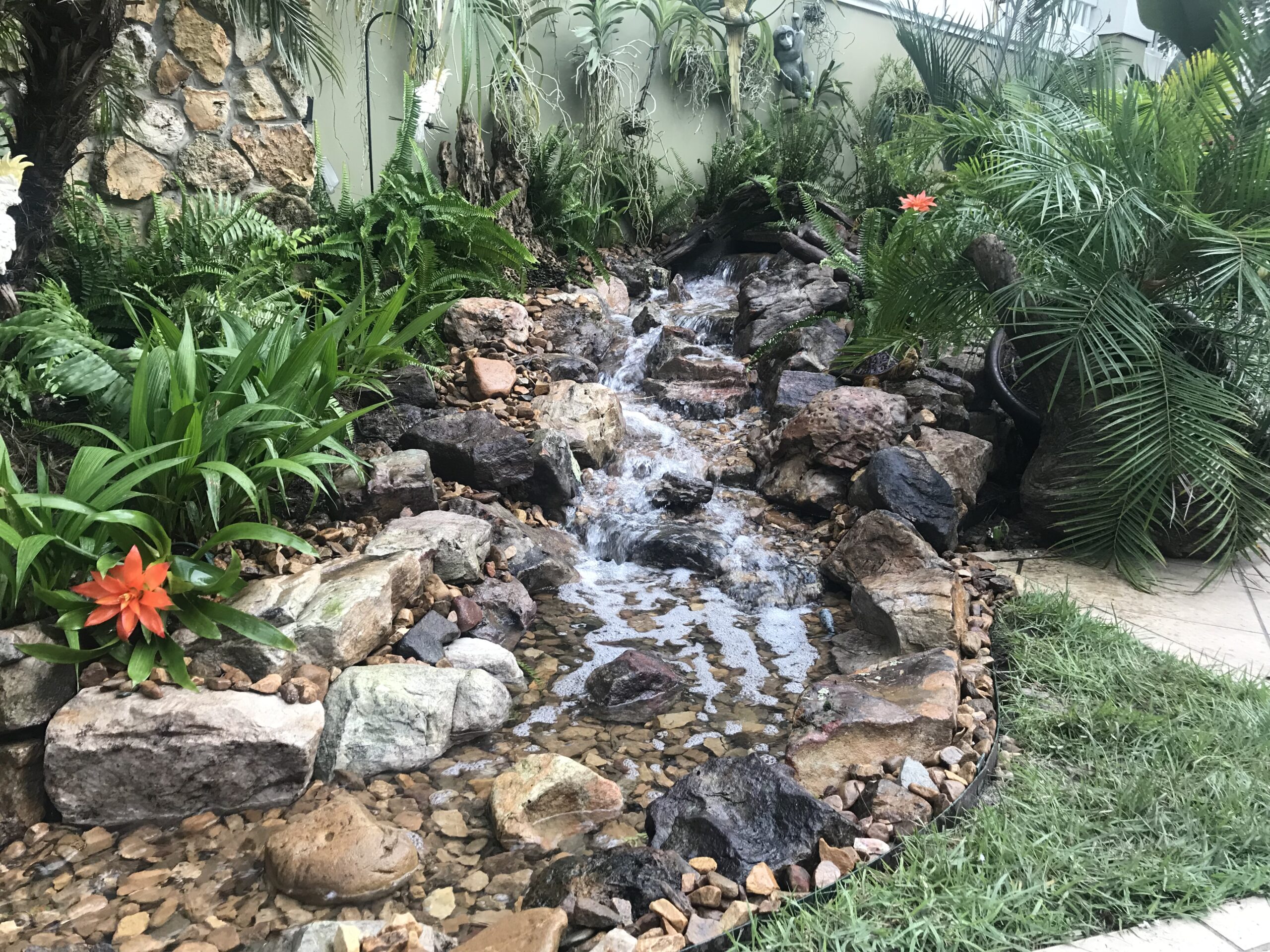 Compact pondless waterfall in a front yard