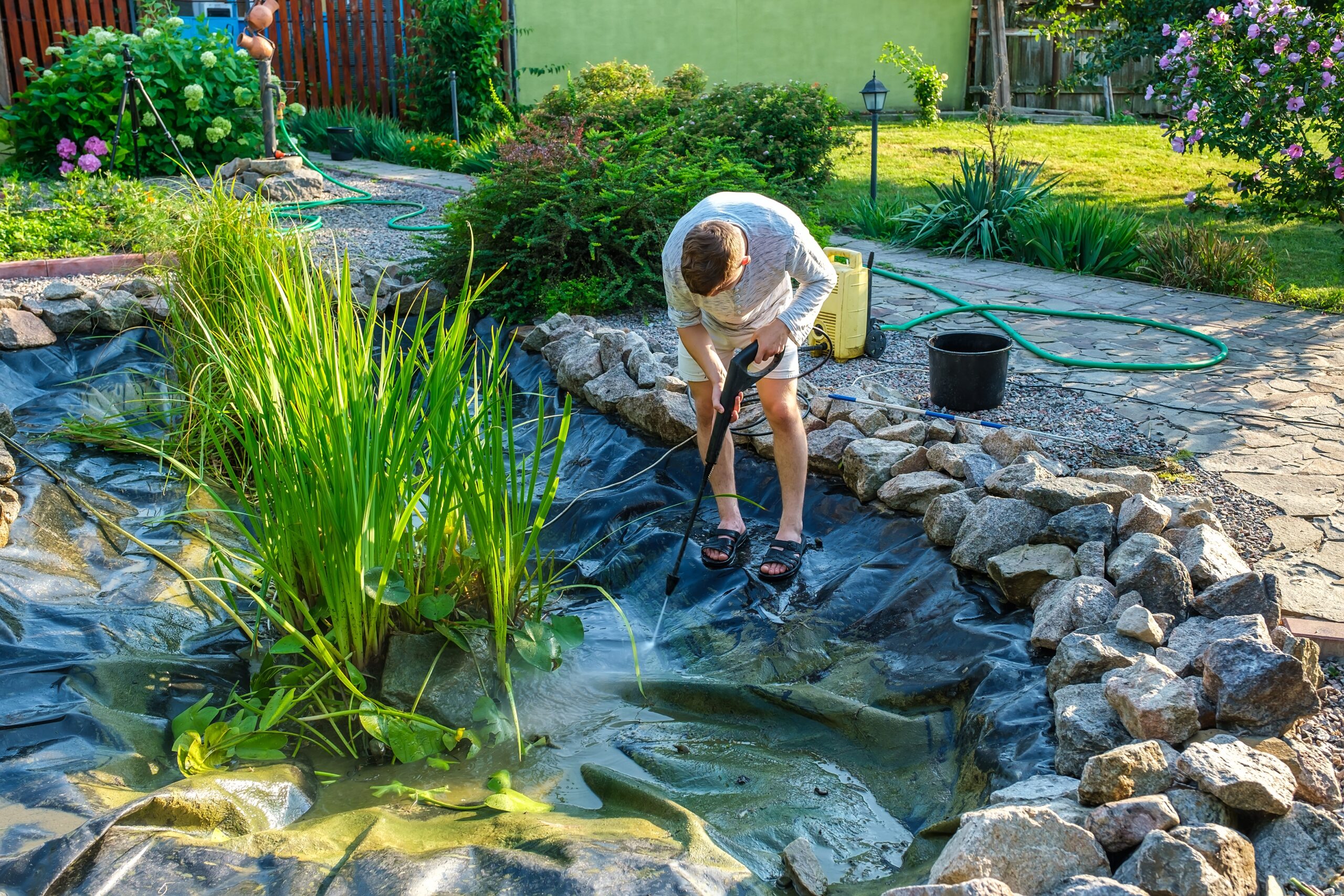 A beautifully renovated pond with a new waterfall